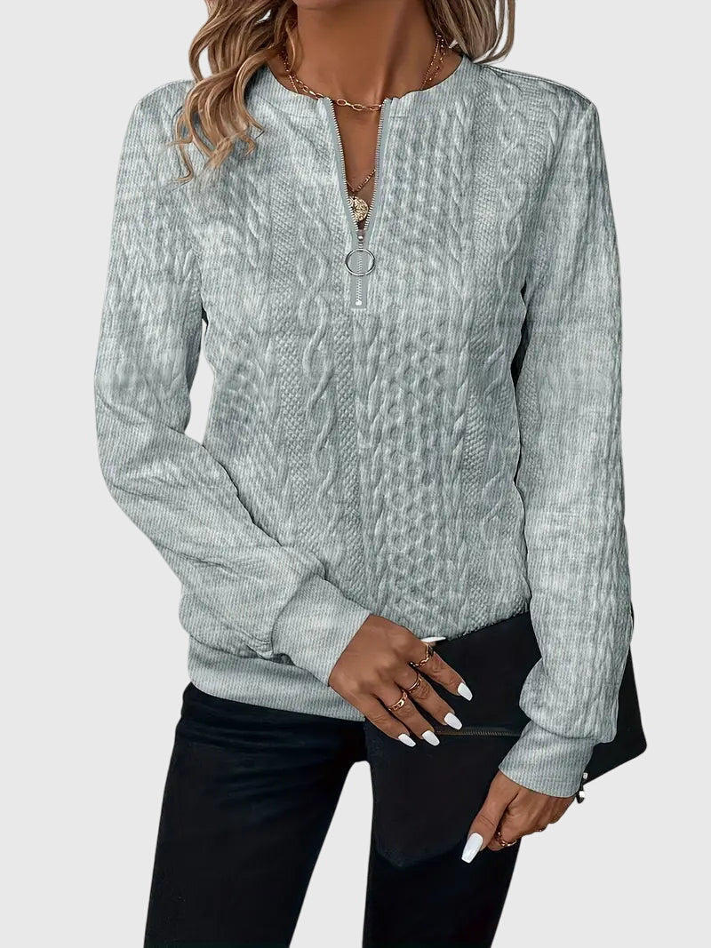 Smidig vardagsblus för dam med långa ärmar och dragkedja
