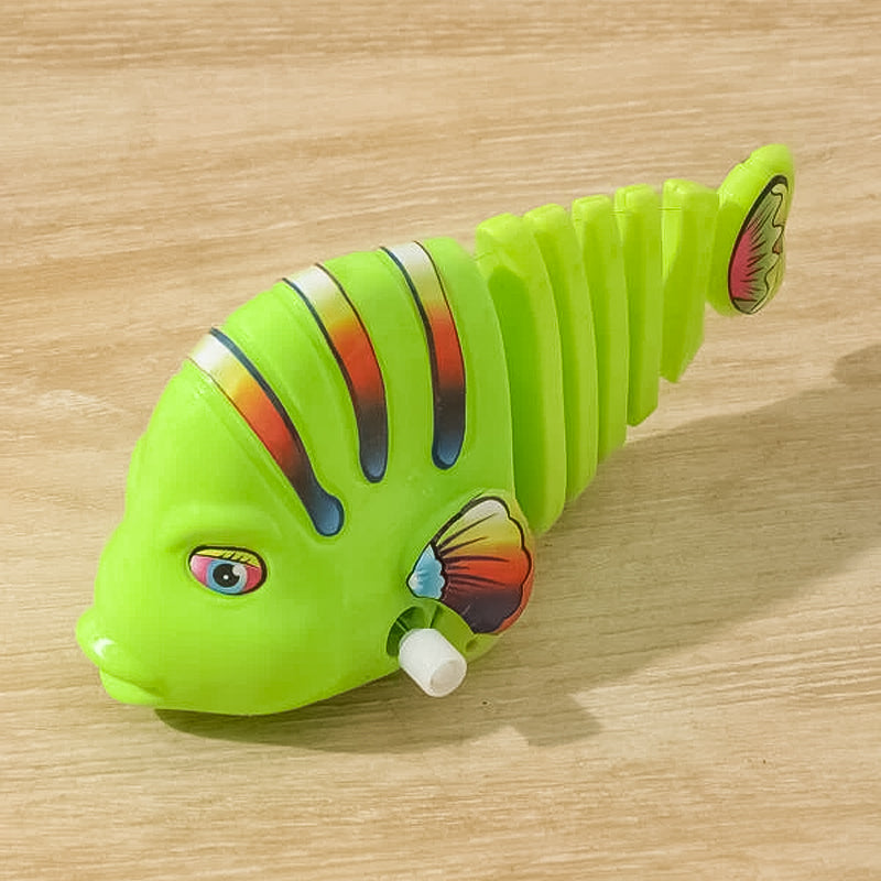 Färgglad fiskleksak för barn med livlig design, 360° rotation och säker plast. Perfekt för kreativ och rolig lek.