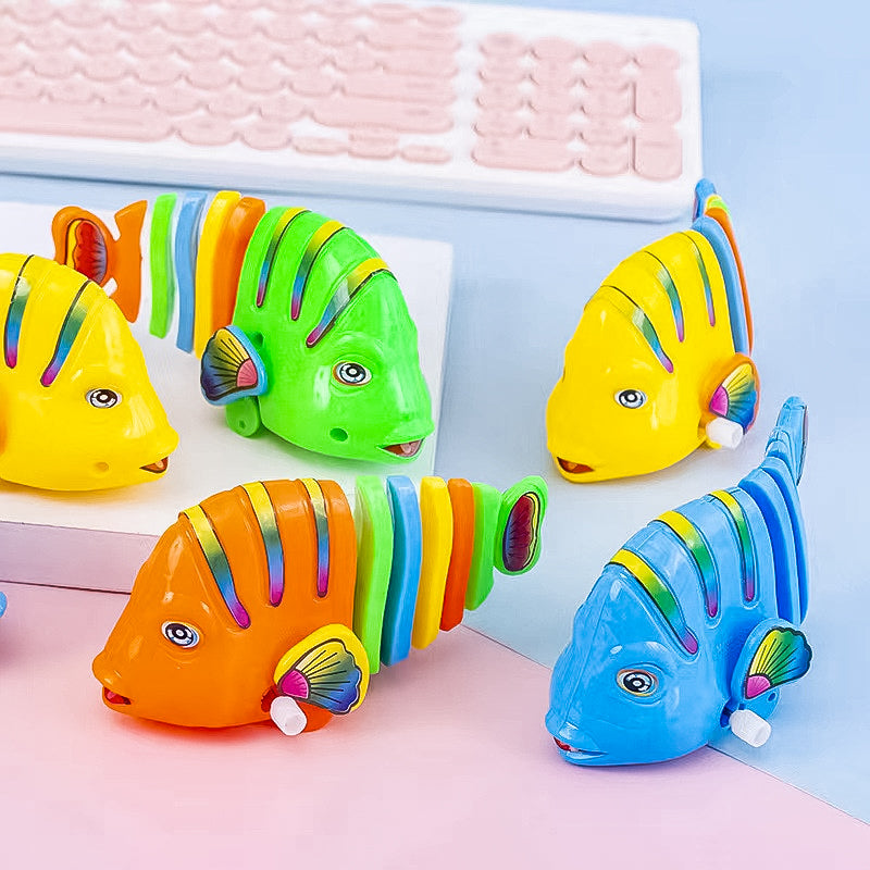 Färgglad fiskleksak för barn med livlig design, 360° rotation och säker plast. Perfekt för kreativ och rolig lek.