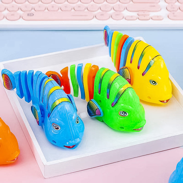 Färgglad fiskleksak för barn med livlig design, 360° rotation och säker plast. Perfekt för kreativ och rolig lek.