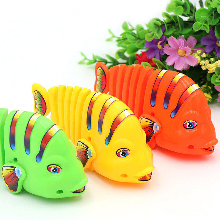 Färgglad fiskleksak för barn med livlig design, 360° rotation och säker plast. Perfekt för kreativ och rolig lek.