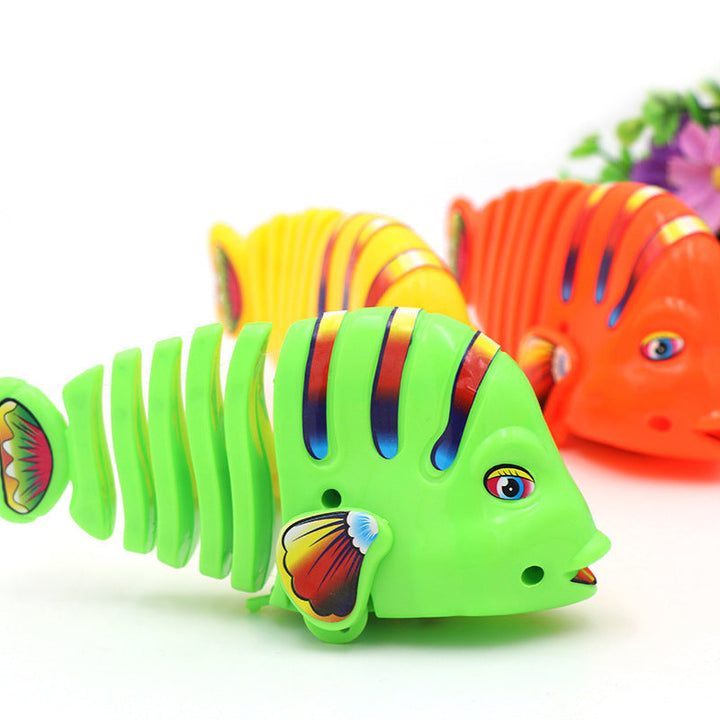 Färgglad fiskleksak för barn med livlig design, 360° rotation och säker plast. Perfekt för kreativ och rolig lek.