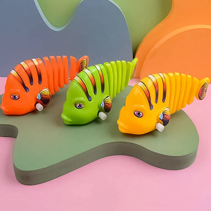 Färgglad fiskleksak för barn med livlig design, 360° rotation och säker plast. Perfekt för kreativ och rolig lek.