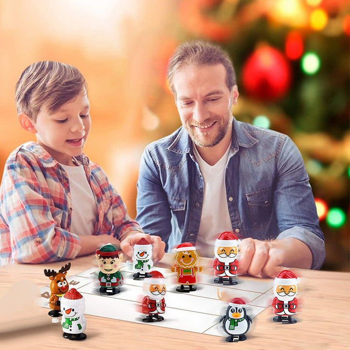 "Färgglad jul urverk leksak för barn, visar snögubbe och renmotiv, hoppar och springer utan batterier."