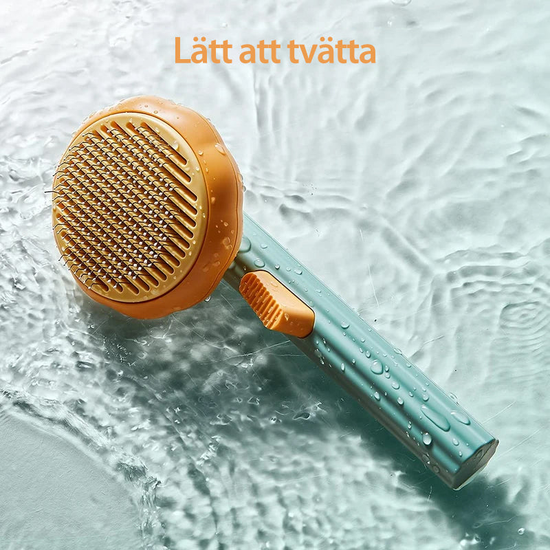 "Färgglad pumpaformad husdjursborste för hundar och katter med ergonomiskt grepp och böjda trådar för djup vård."