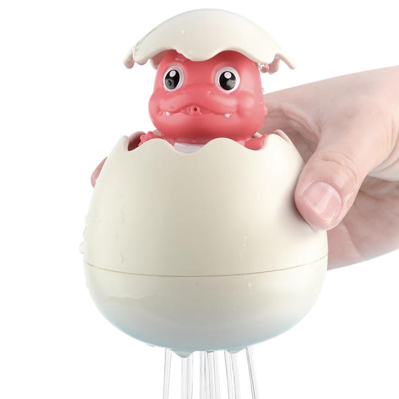 "Färgglatt dinosaurie- och ankägg badleksak för barn, perfekt för vattenlek, med gul, rosa, grön och blå färgkombination."