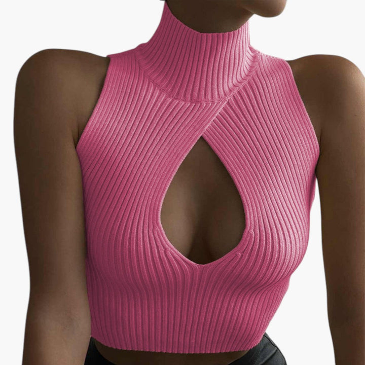 Modern croppad damtopp med ärmlös design, hög krage & trendig utskärning. Ribbad, figurnära stil.