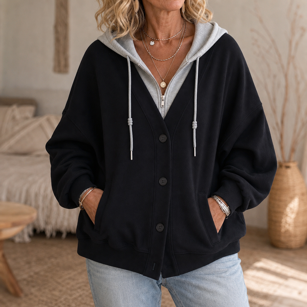Svart hoodie för dam med vit krage och ärmslut i lager-effekt
