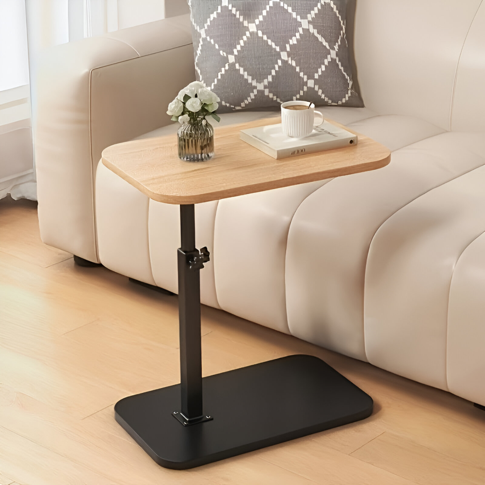 Sidobord bredvid en soffa, höj- & sänkbart för optimal bekvämlighet.