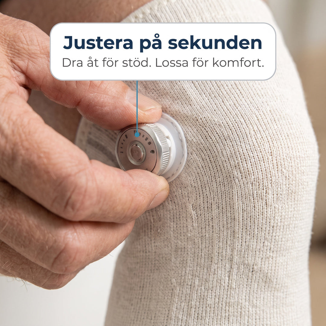 Närbild på person som justerar kompressionen på Zvarelo knästöd med vridknopp