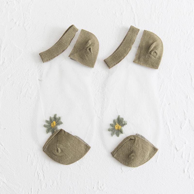 Genomskinliga damsockor med blommotiv, feminin design med spets- och blomdetaljer, perfekt för sommaroutfits.