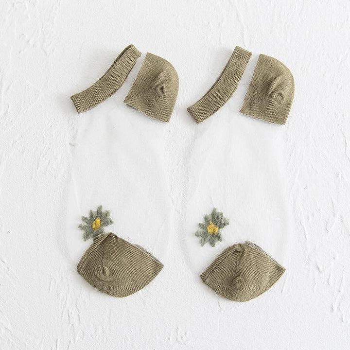 Genomskinliga damsockor med blommotiv, feminin design med spets- och blomdetaljer, perfekt för sommaroutfits.