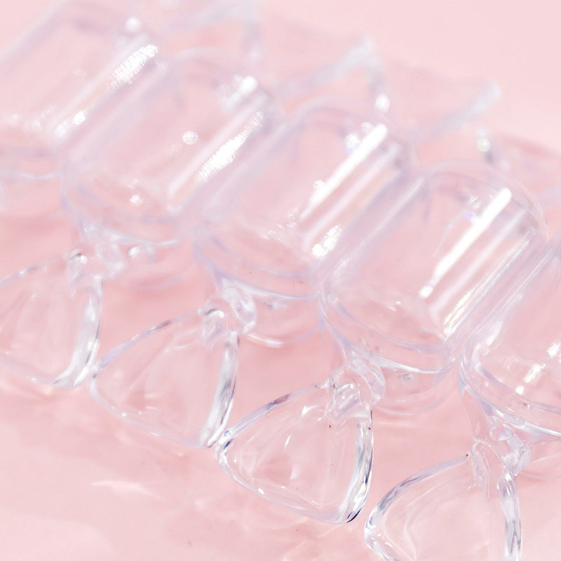 "Genomskinliga godisformade smyckeskrin i klar plast, 10-pack för elegant och kreativ smyckesförvaring."