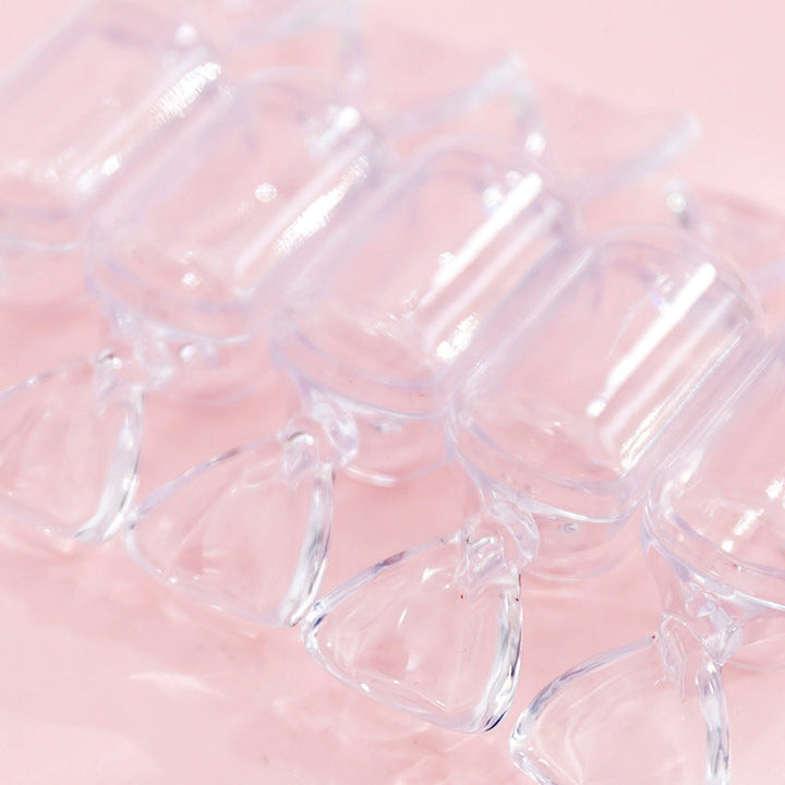 "Genomskinliga godisformade smyckeskrin i klar plast, 10-pack för elegant och kreativ smyckesförvaring."