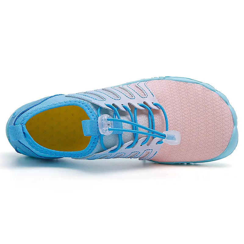 Rosa flexibla barfotaskor Jett, unisex design för optimal fotrörelse och strandaktiviteter.