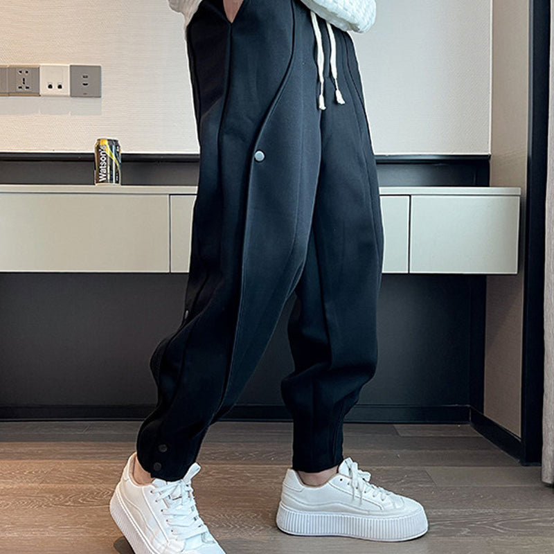 "Grå slim fit träningsbyxor för män i bomull/polyester, eleganta med elastisk midja för stil och komfort."