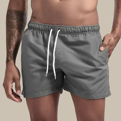 Grå klassiska badshorts för män med elastisk midja och ficka