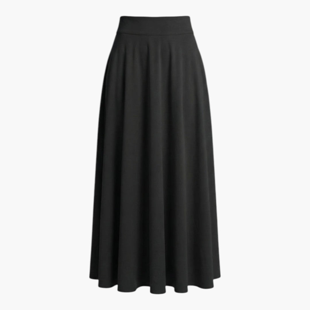 Elegant kvinnors långkjol med brett midjeband och sidofickor. Högmidjad, bekväm utsvängd maxikjol för många tillfällen.