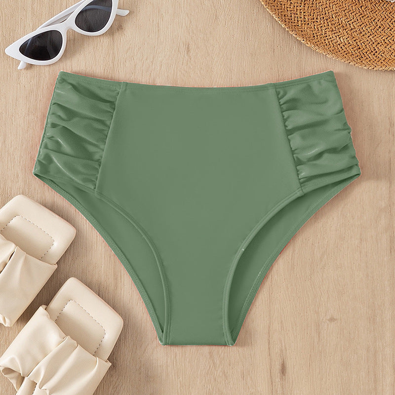 Dam bikiniunderdel med hög midja och sofistikerade volangdetaljer. Perfekt för sommarens alla badtillfällen.