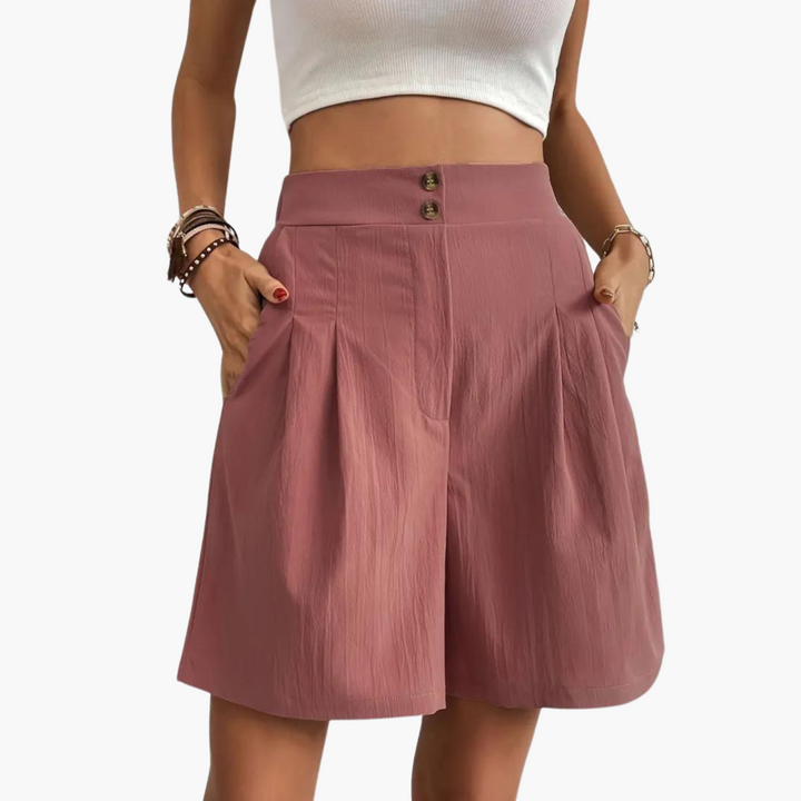 Elegant plisserad minikjol med hög midja som ger en feminin och sofistikerad look.