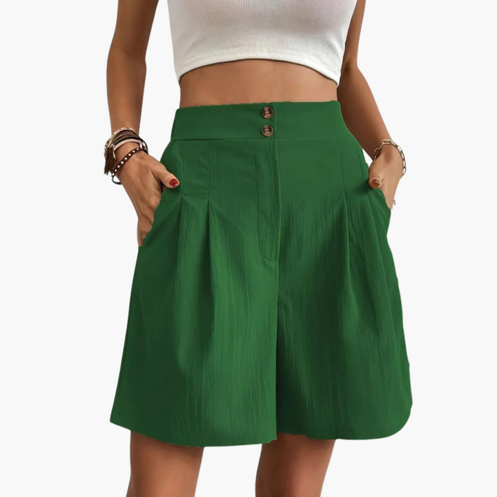 Trendig A-linje minikjol med hög midja och dolda fickor, perfekt för en modern sommarstil.