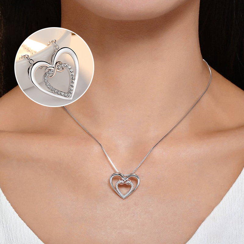 "Halsband med evighetshjärta i vitguld och roséguld för kvinnor, elegant och tidlös design för speciella tillfällen."
