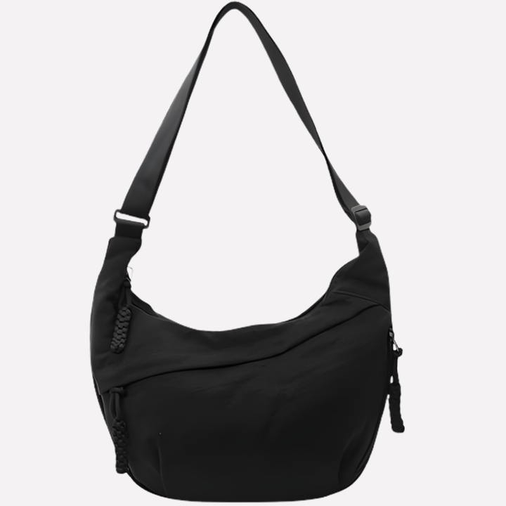Svart crossbody väska i halvmåne design med justerbar rem för vardag