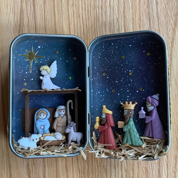 "Handgjord julkrubba med figurer som Maria, Josef, Jesus under stjärnklar natt, perfekt för festlig dekoration."