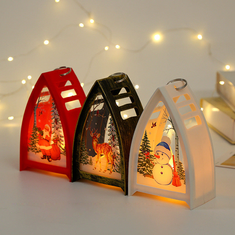 Handmålad LED juldekoration med snögubbedesign för julbord, skapar en magisk och festlig stämning i hemmet.