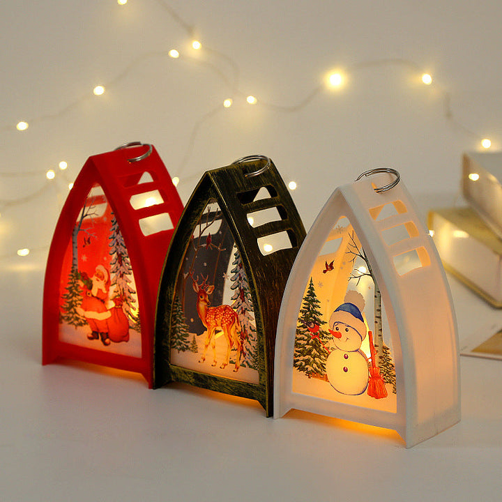 Handmålad LED juldekoration med snögubbedesign för julbord, skapar en magisk och festlig stämning i hemmet.