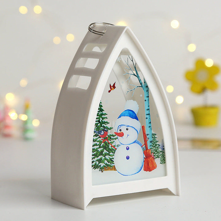 Handmålad LED juldekoration med snögubbedesign för julbord, skapar en magisk och festlig stämning i hemmet.