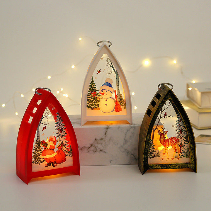 Handmålad LED juldekoration med rådjur-, snögubbe- och tomtedesign för julbord, skapar en magisk och festlig stämning i hemmet.