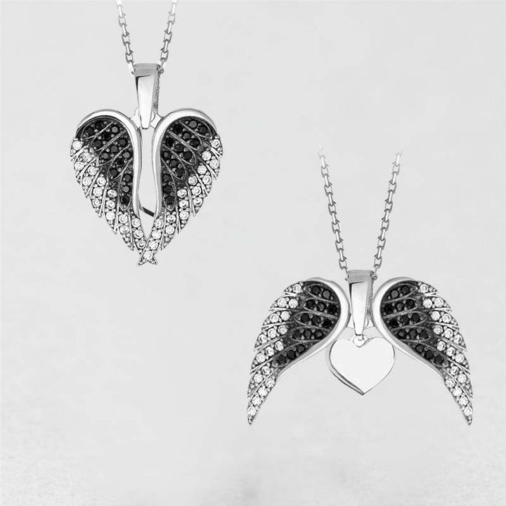 "Hängande halsband med hjärta och änglavingar, silverglänsande, smycket för damer, symbol för skydd och hopp."