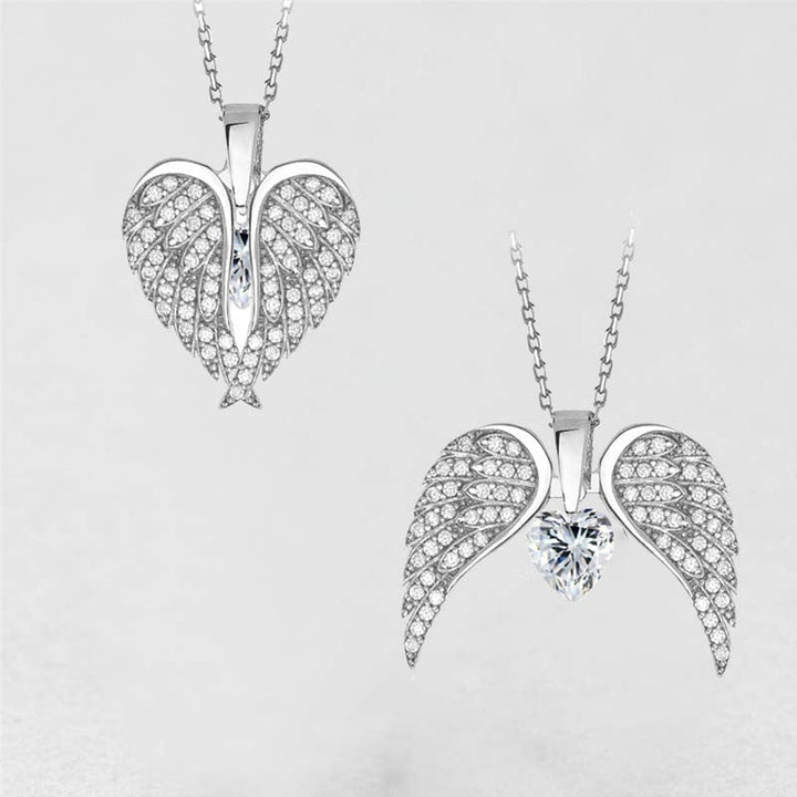 "Hängande halsband med hjärta och änglavingar, silverglänsande, smycket för damer, symbol för skydd och hopp."