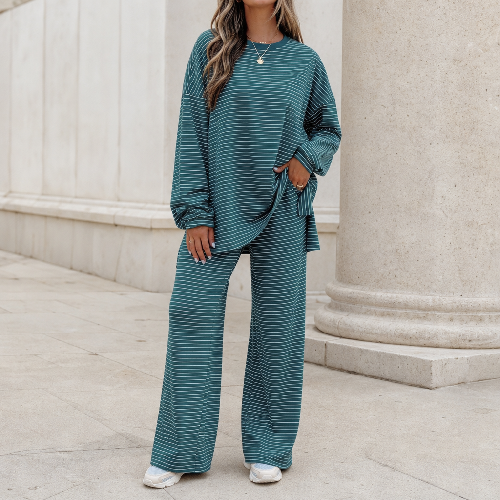 Dam set med randig pullover och vida byxor för vardag