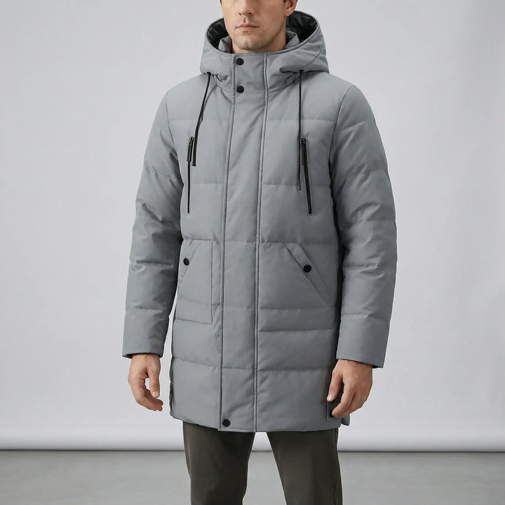 Slitstark herr vinterjacka med huva, designad för extrem kyla. Vindtät och vattenavvisande parkas.