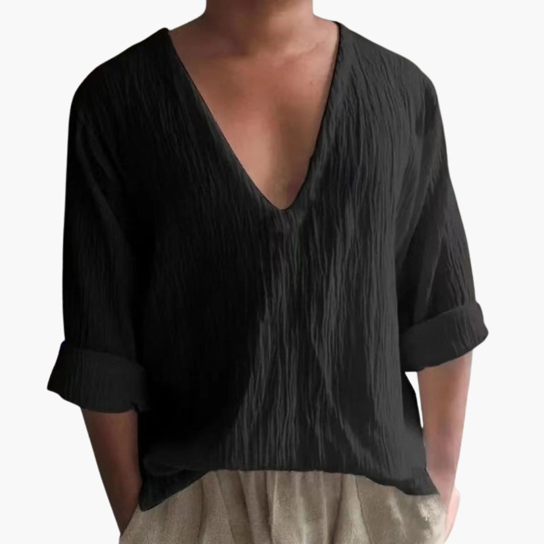 Texturerad herr T-shirt, V-ringad med korta, uppvikta ärmar. Perfekt för ledigt vardagsmode och sommar.