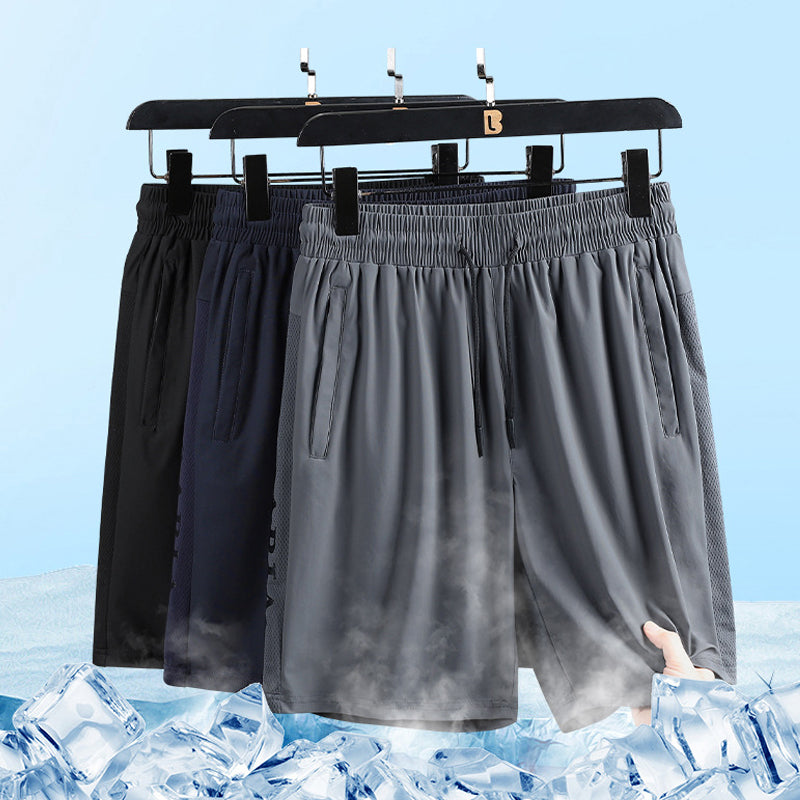 "Herrens sommar stretchiga sportshorts i grått, elastisk midja, praktiska fickor, perfekt för träning och fritid."
