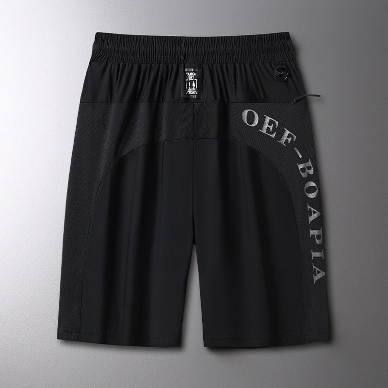 "Herrens sommar stretchiga sportshorts i grått, elastisk midja, praktiska fickor, perfekt för träning och fritid."
