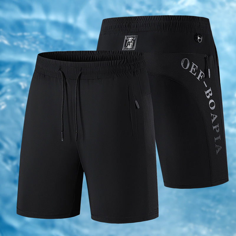 "Herrens sommar stretchiga sportshorts i grått, elastisk midja, praktiska fickor, perfekt för träning och fritid."