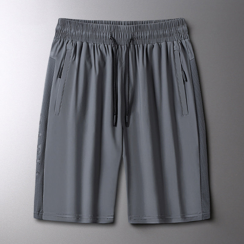 "Herrens sommar stretchiga sportshorts i grått, elastisk midja, praktiska fickor, perfekt för träning och fritid."