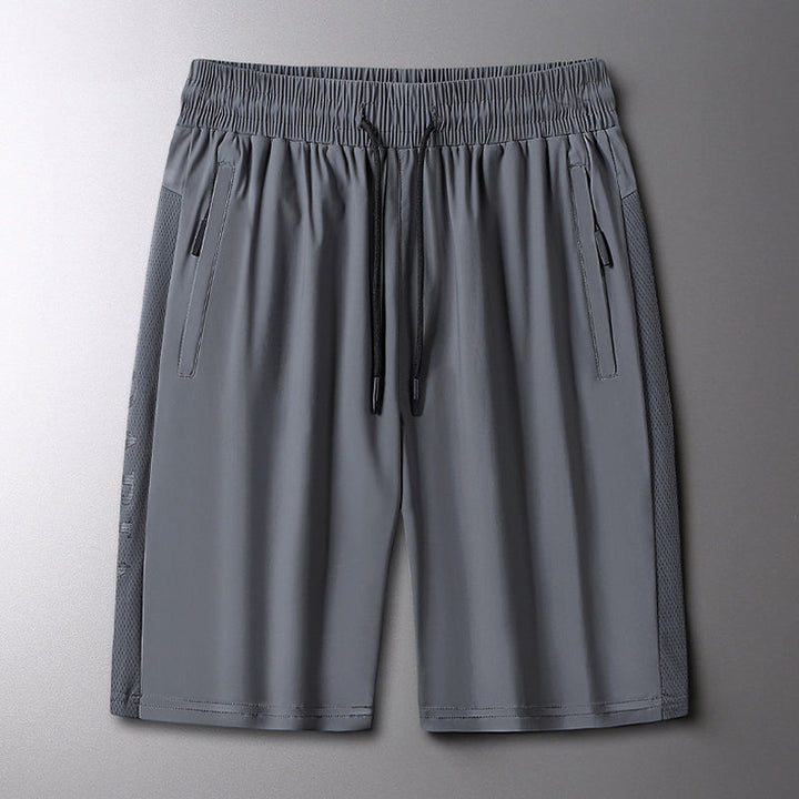 "Herrens sommar stretchiga sportshorts i grått, elastisk midja, praktiska fickor, perfekt för träning och fritid."