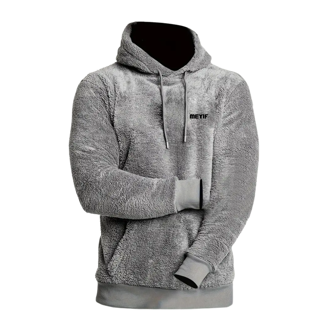 Grå vinterhoodie för herr, plyschfodrad. Ett bekvämt och varmt plagg för kalla dagar.