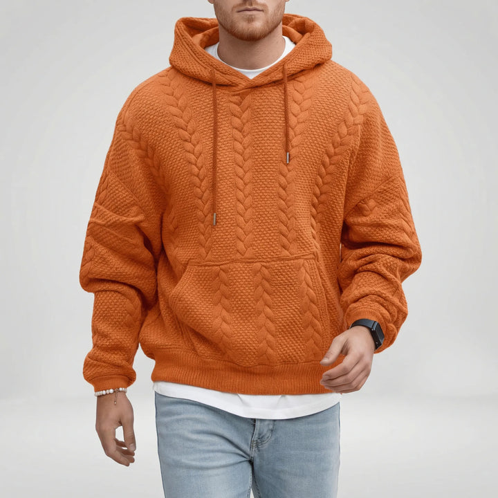 Mjuk herr pullover hoodie Logan med detaljerat flätmönster. Bekväm och trendig för en avslappnad stil.