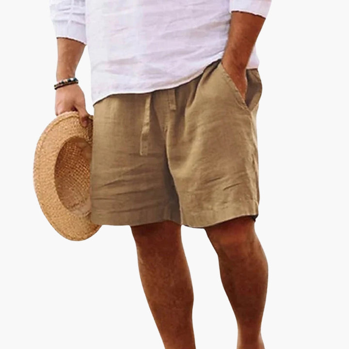 Herrshorts med dragsko & fickor, bekväma för sommar & fritid. Enfärgade, lös passform för casual stil.