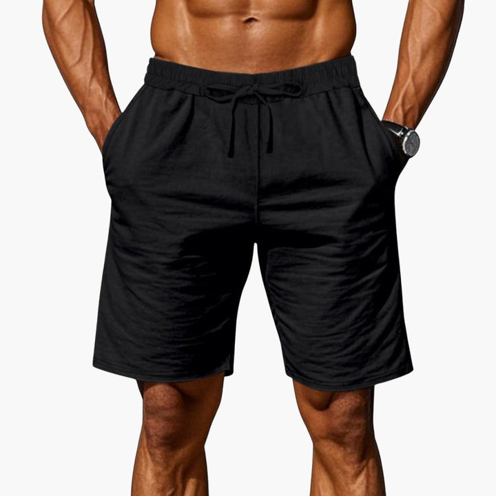 Stilrena herrshorts med bekväm elastisk midja och praktiska fickor. Mångsidiga för sommar och fritid.