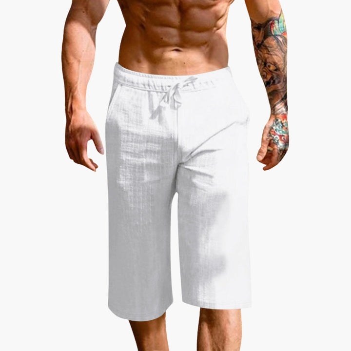 Herrsportshorts med elastisk midja och raka ben. Enfärgade, bekväma pull-on shorts för träning & vardag.