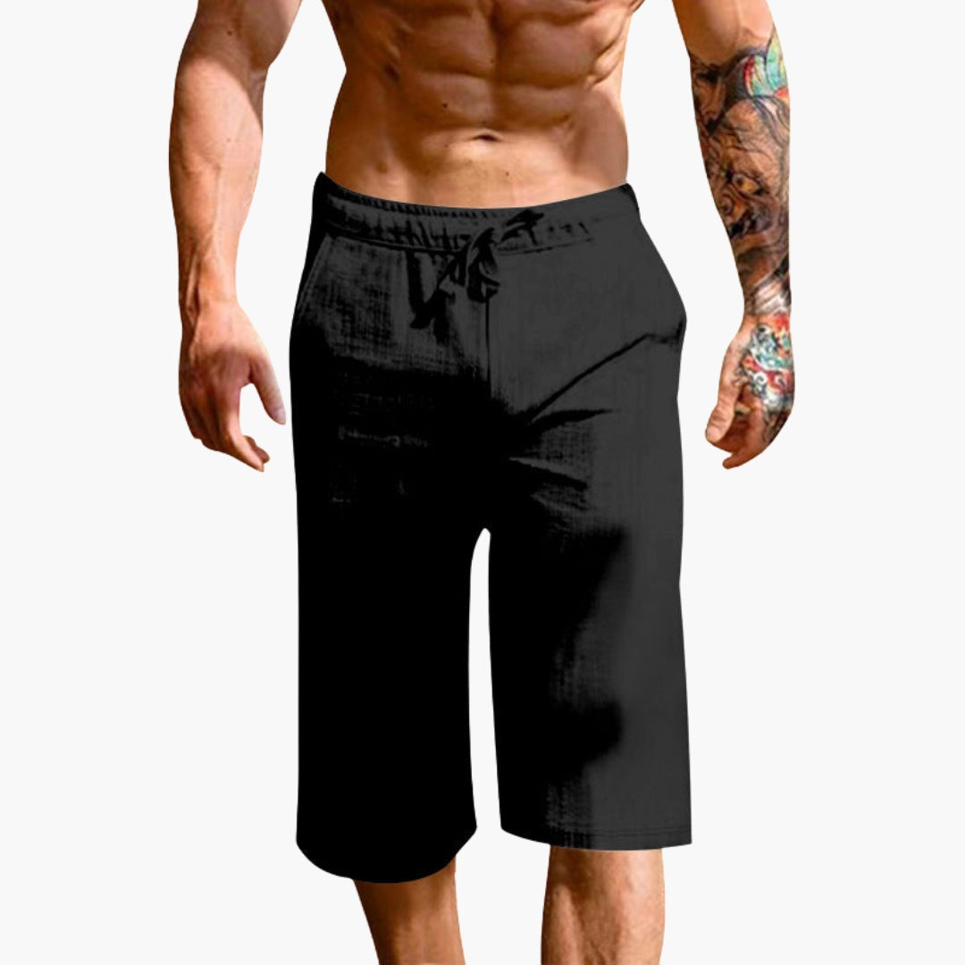 Träningsshorts för herr, enfärgade med elastisk midja och raka ben. Idealiska för sport, gym & vardagsbruk.