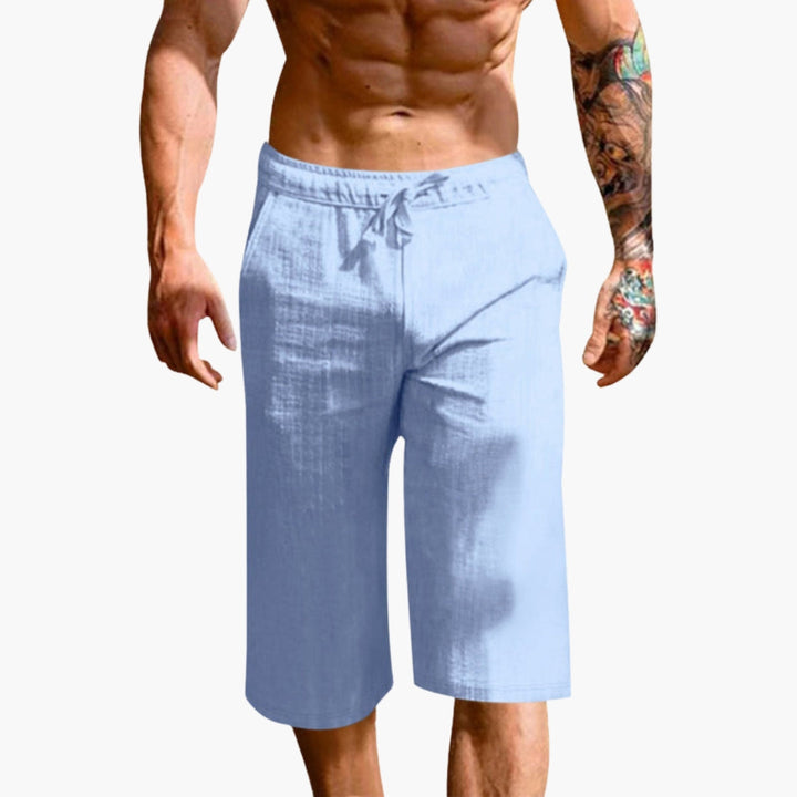 Mångsidiga herrshorts med elastisk midja och raka ben. Pull-on modell för träning, vardag och sommar.