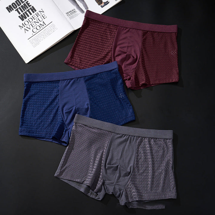 "Herrunderkläder med andningsfunktion, grå boxers i mjukt material, mellanhög midja för optimal komfort och passform."